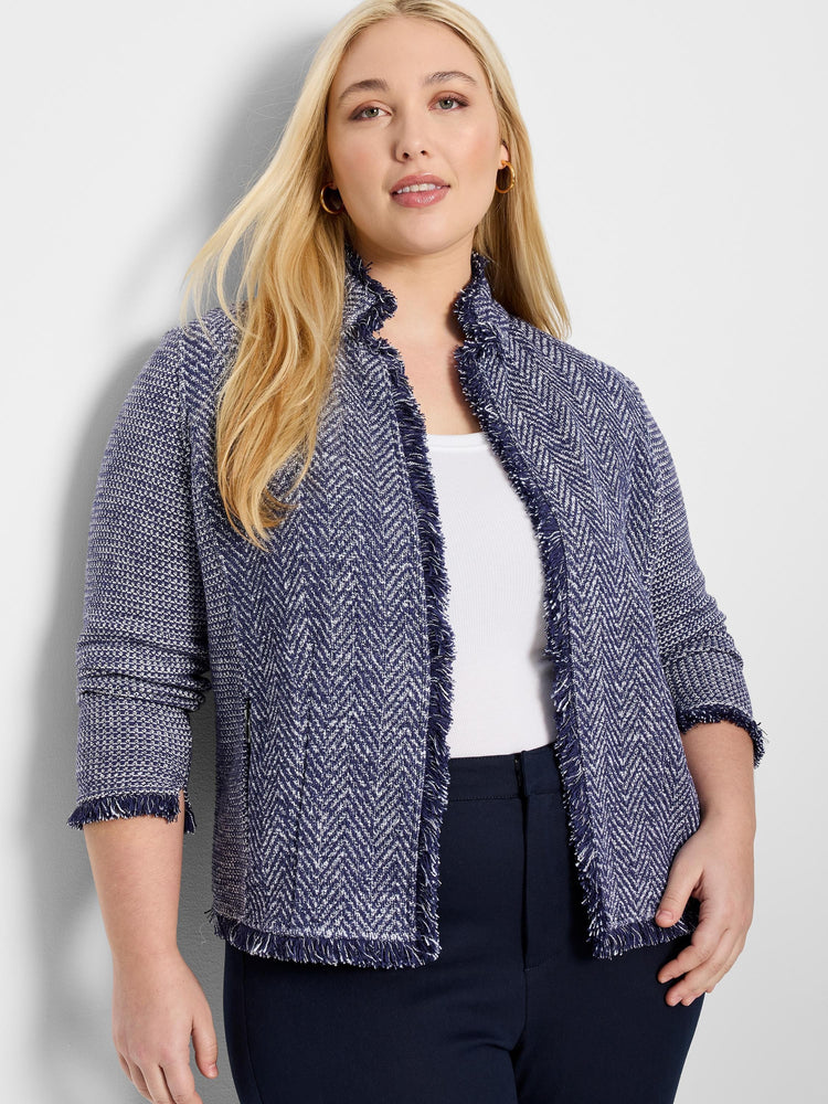 Navy blue and white herringbone knit jacket with fringe trim. Three-quarter sleeves. Notch collar.