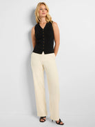 Black ribbed sleeveless sweater vest with gold buttons, V-neck.