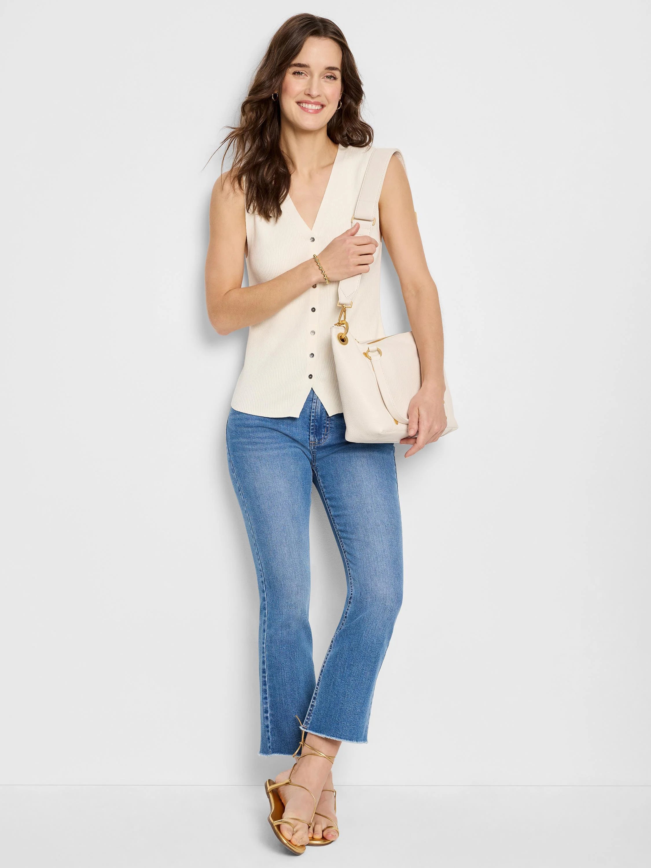 Off-white ribbed sleeveless sweater vest with front buttons.