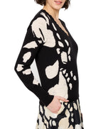 Black long-sleeved v-neck sweater with an off-white abstract design.