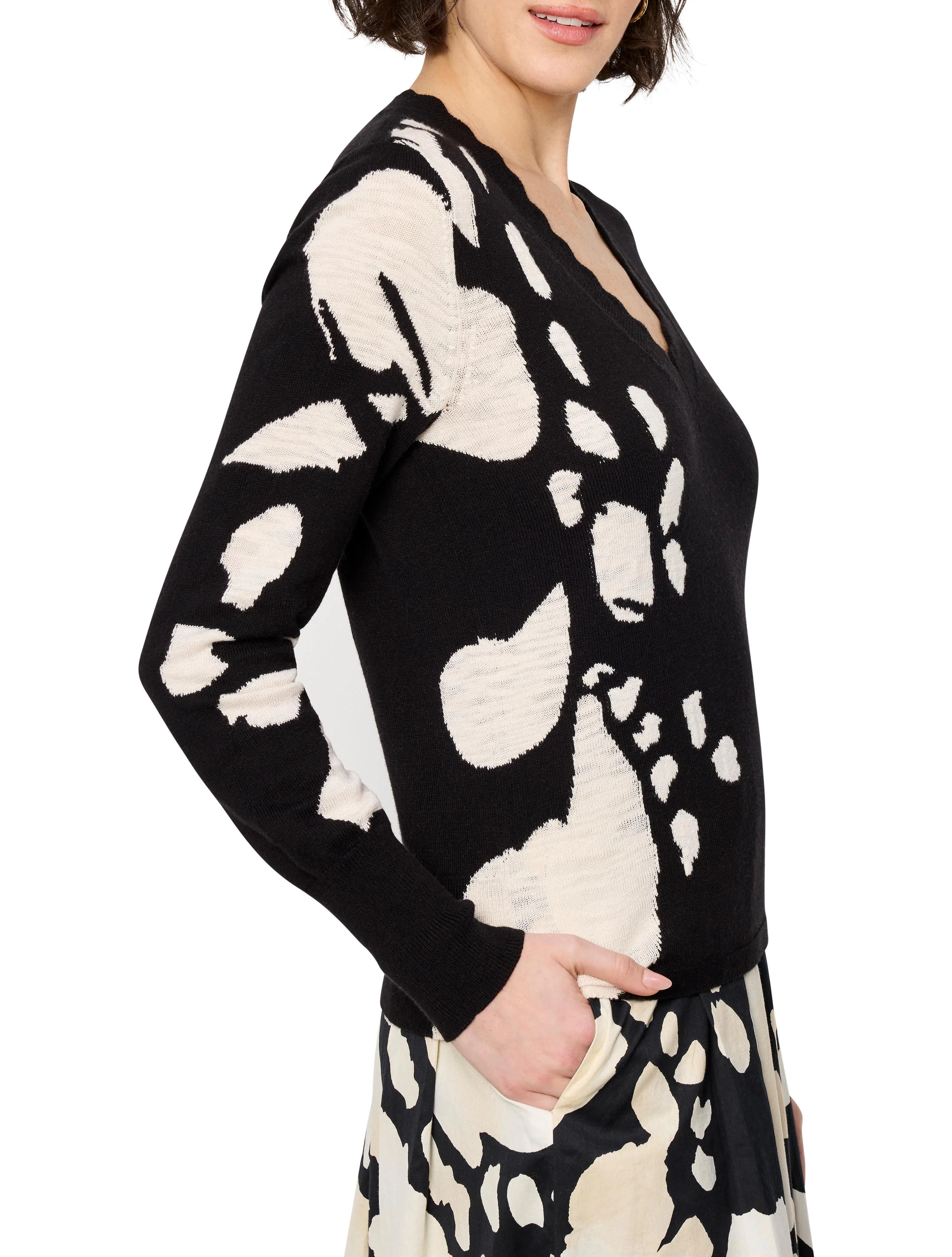 Black long-sleeved v-neck sweater with an off-white abstract design.