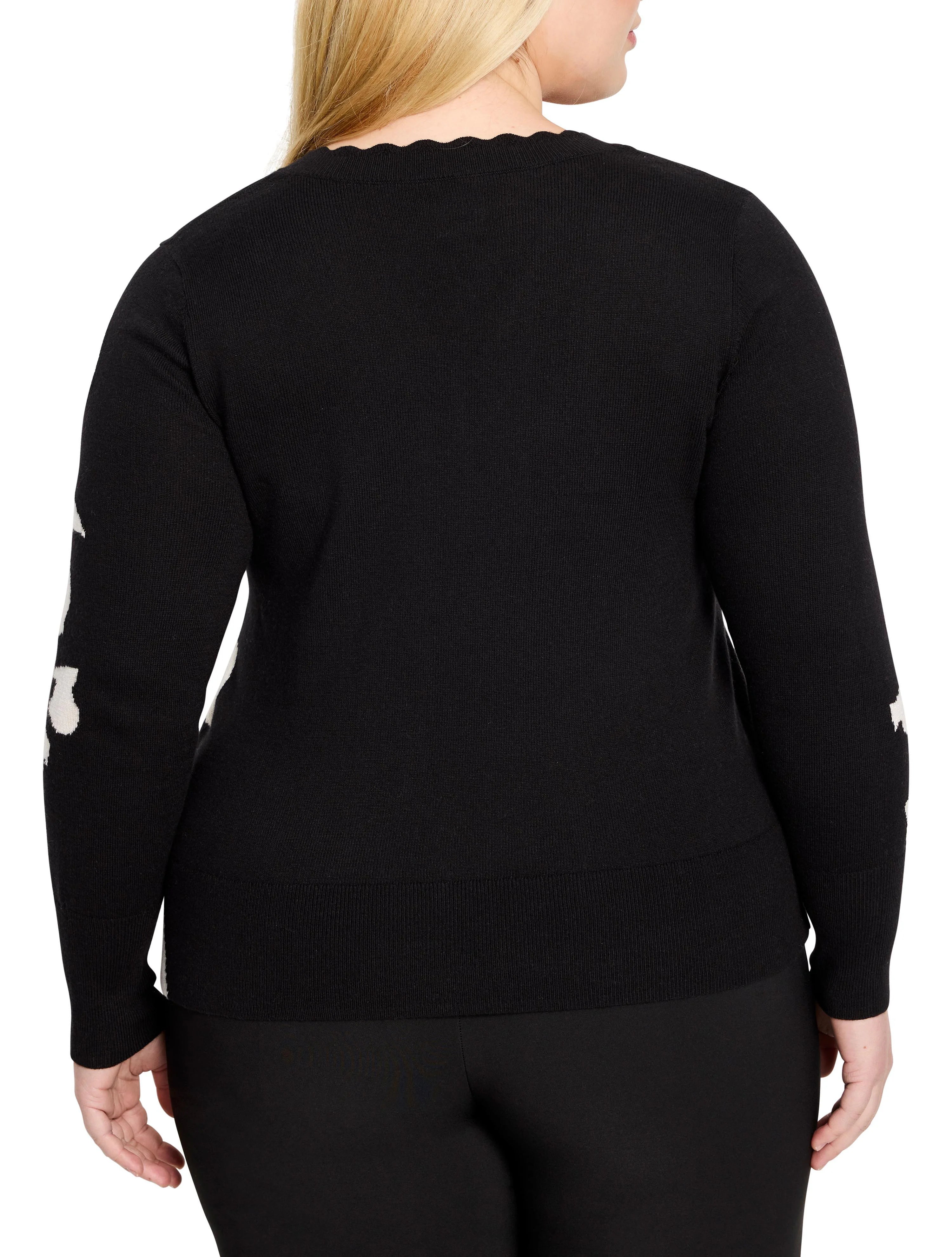 Black sweater with off-white petal accents on sleeves, scalloped neckline.  Long sleeves.