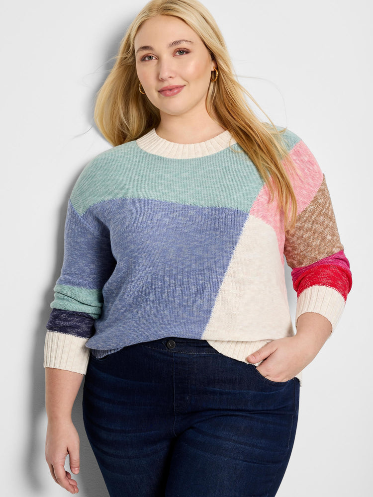 Color-blocked crewneck sweater. Features teal, periwinkle, cream, tan, and pink sections. Long sleeves with cream,...