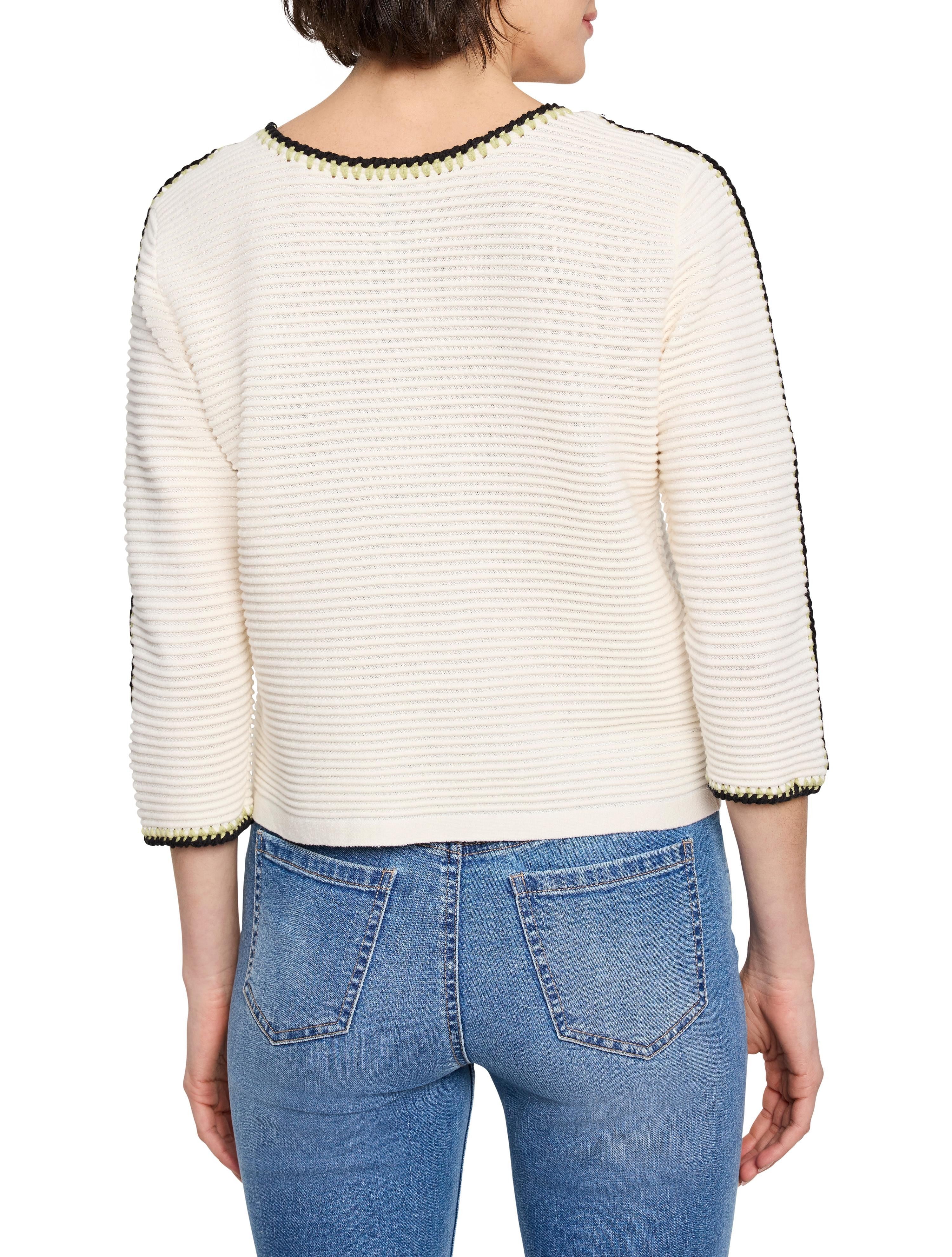 Off-white ribbed sweater with black and light green trim at neckline and sleeves.  Three-quarter sleeves.