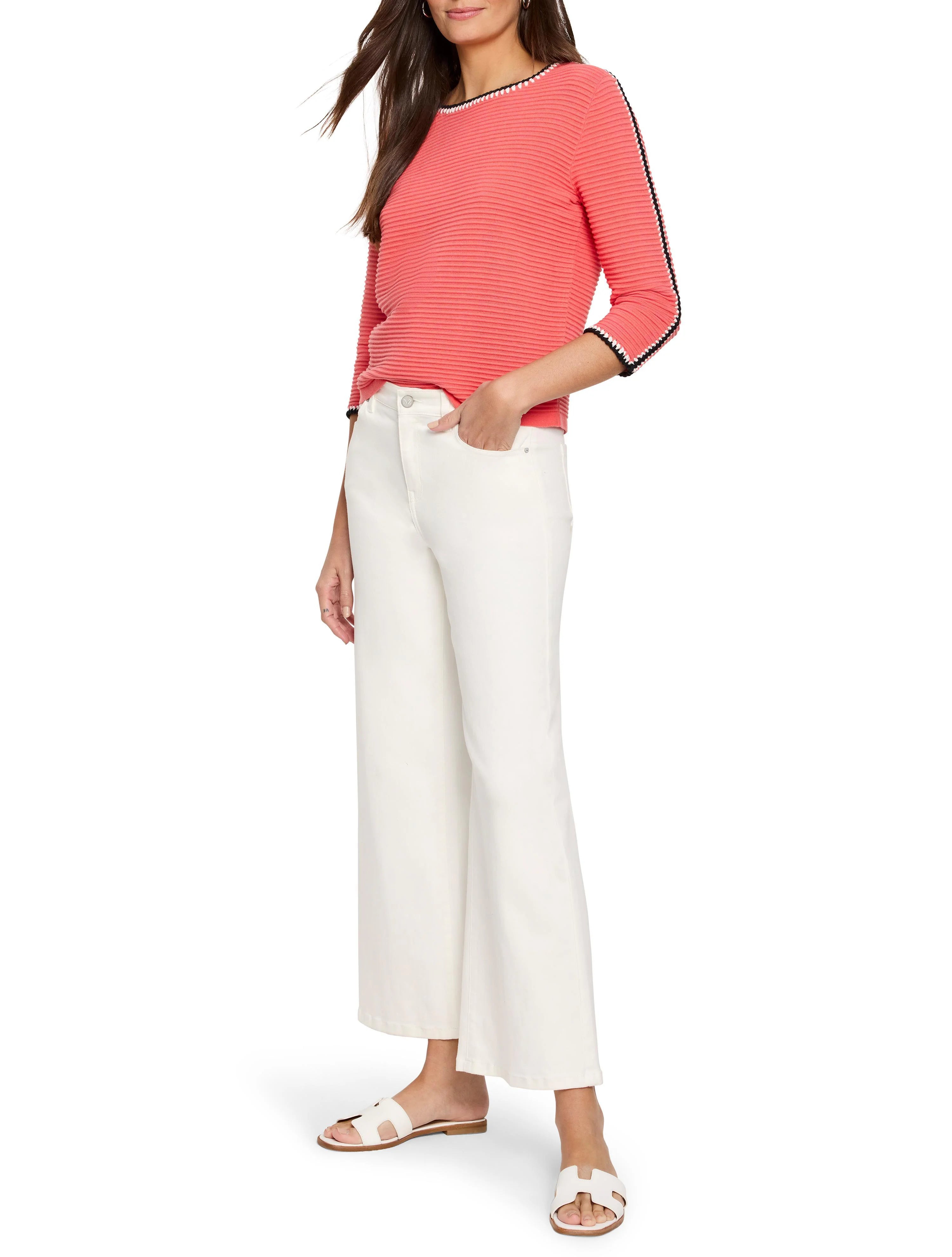 Coral ribbed sweater, three-quarter sleeves. Neckline and sleeve cuffs have black and white trim.