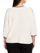 Off-white ribbed sweater with black and light green trim at neckline and sleeves.  Three-quarter sleeves.