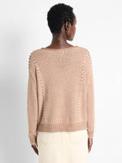 Brown and cream horizontally striped cotton sweater.  Seamed detail at shoulders and sides.  Long sleeves, V-neck.