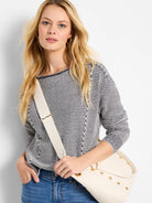 Cream and navy blue horizontally striped cotton sweater. Long sleeves, round neckline. Seams visible.