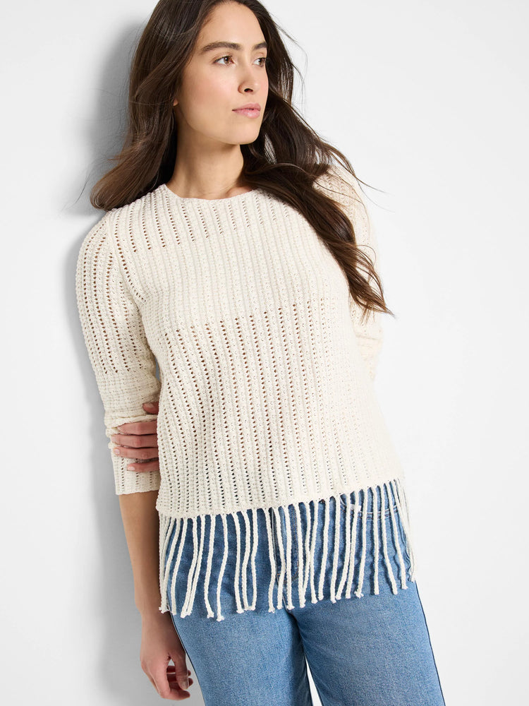 Off-white, open-knit sweater with fringe bottom. Three-quarter sleeves.