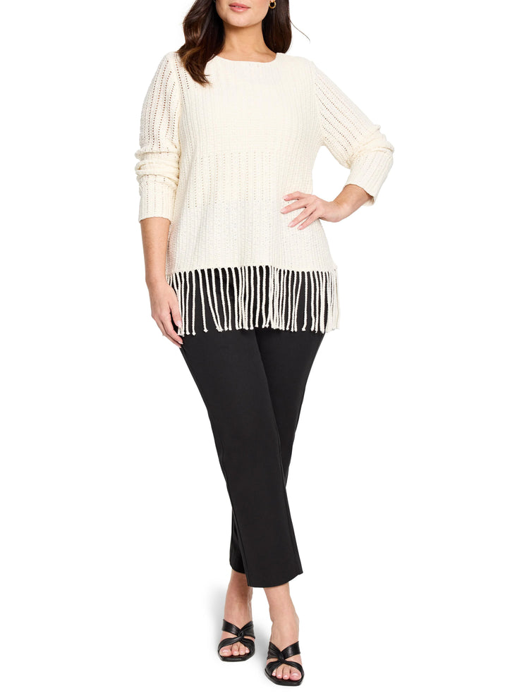 Off-white knit sweater with fringe bottom hem. Long sleeves.