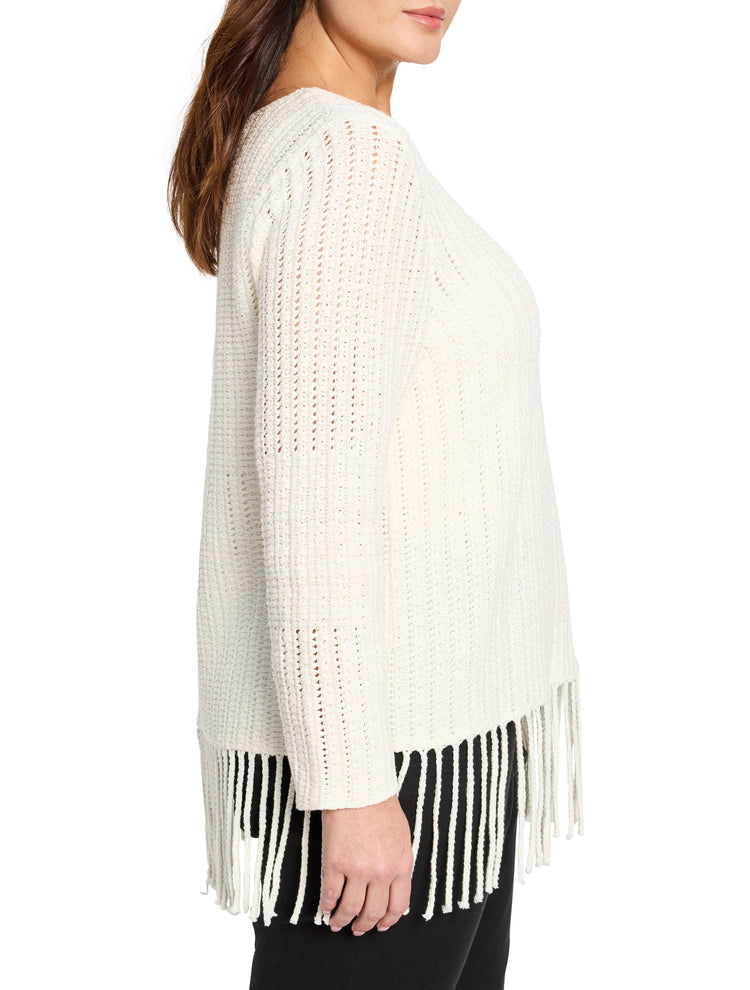 Off-white, open-knit sweater with fringe at the bottom. Three-quarter sleeves.