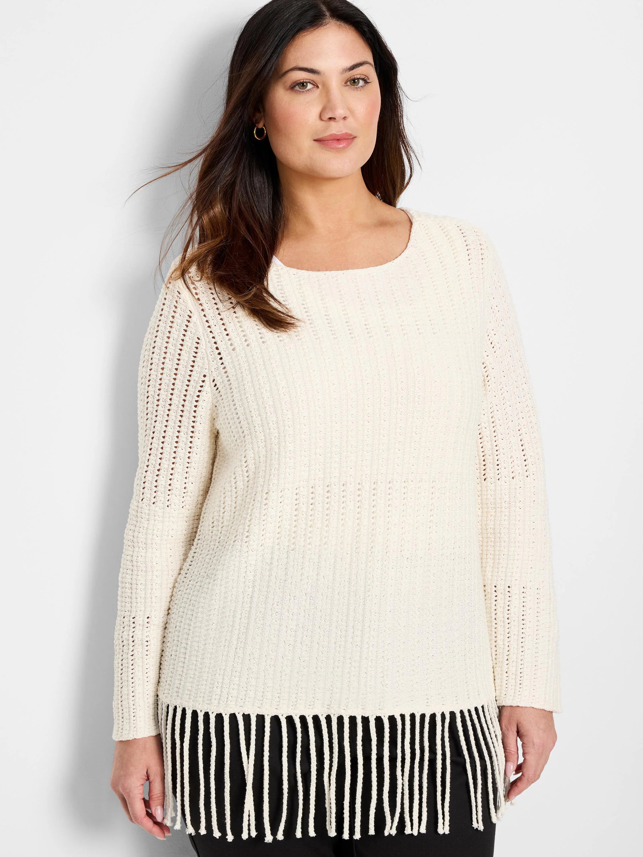 Off-white, textured knit sweater with fringe hem and long sleeves.