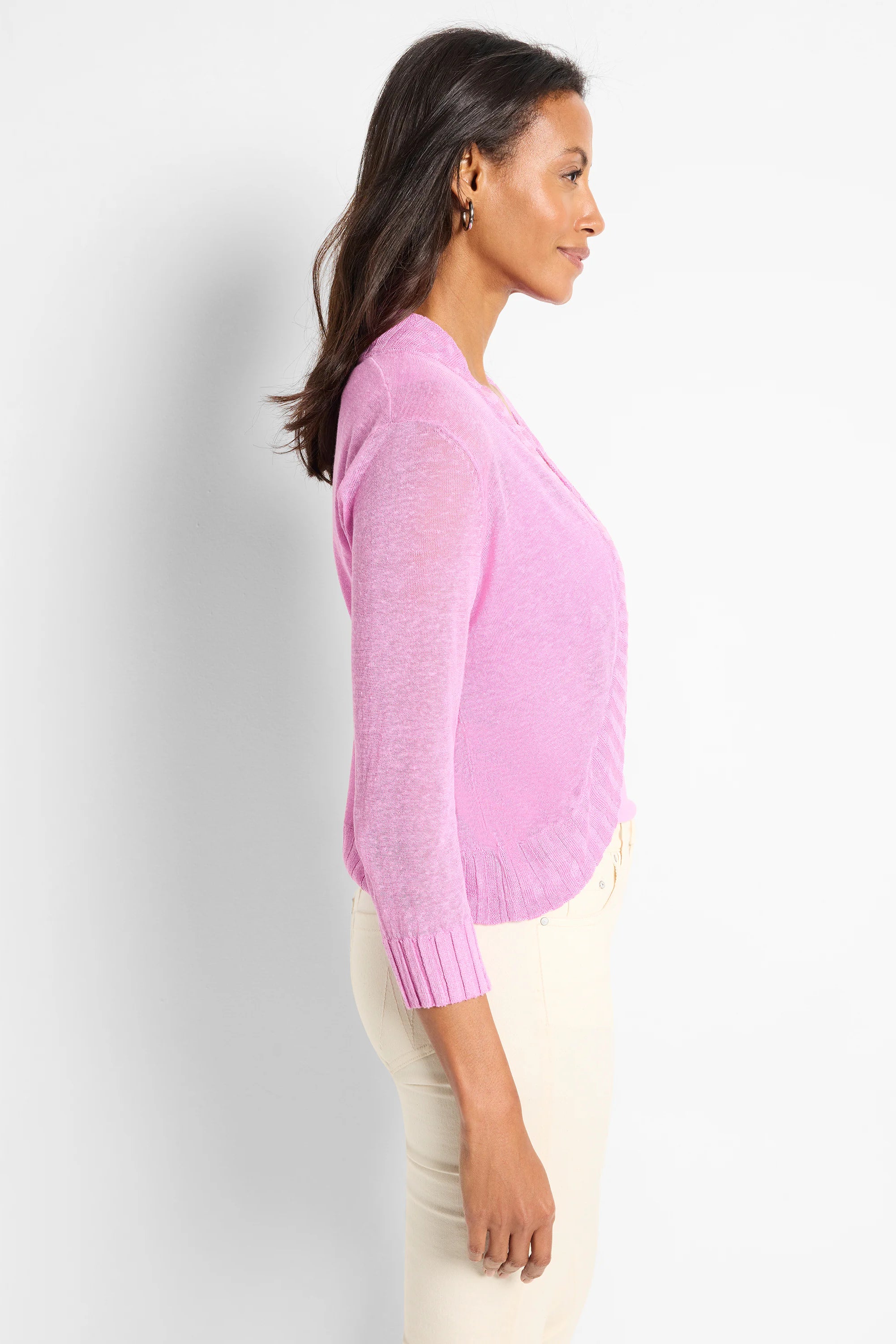 Pink bolero cardigan with 3/4 sleeves, sheer knit fabric, and ribbed cuffs and hem.