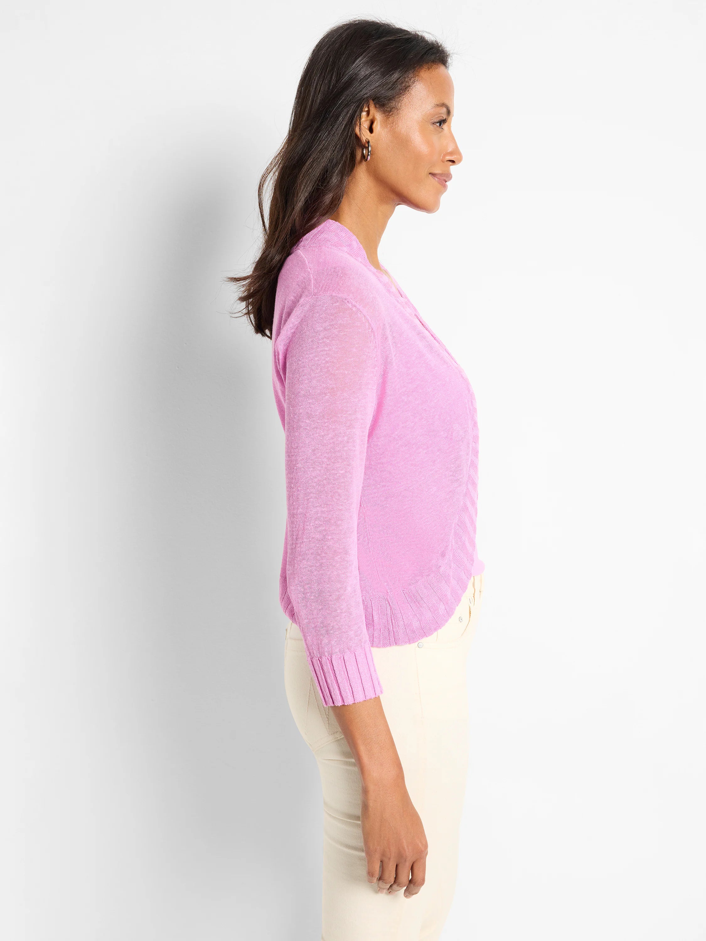 Pink bolero cardigan with 3/4 sleeves, sheer knit fabric, and ribbed cuffs and hem.