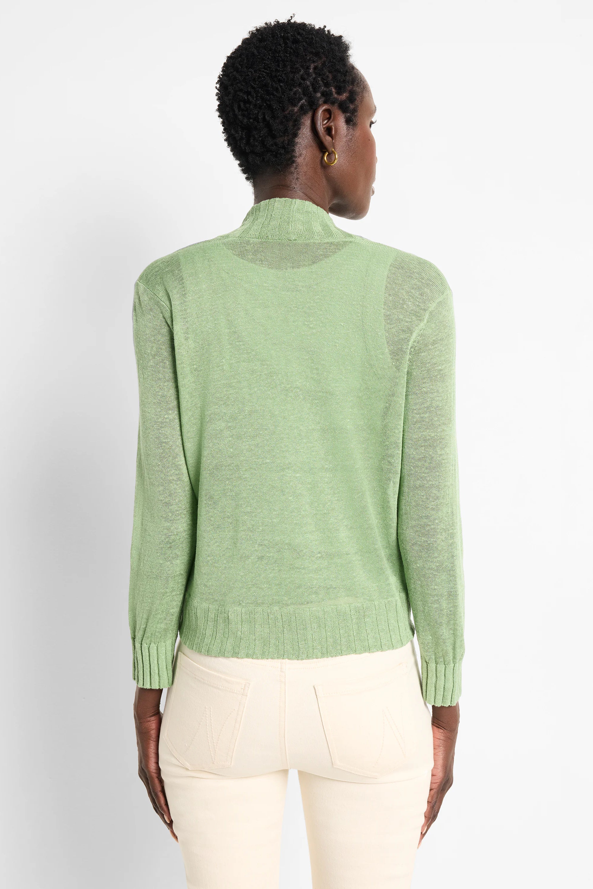 Light green sheer knit bolero cardigan with high neck, long sleeves, and ribbed cuffs & hem.
