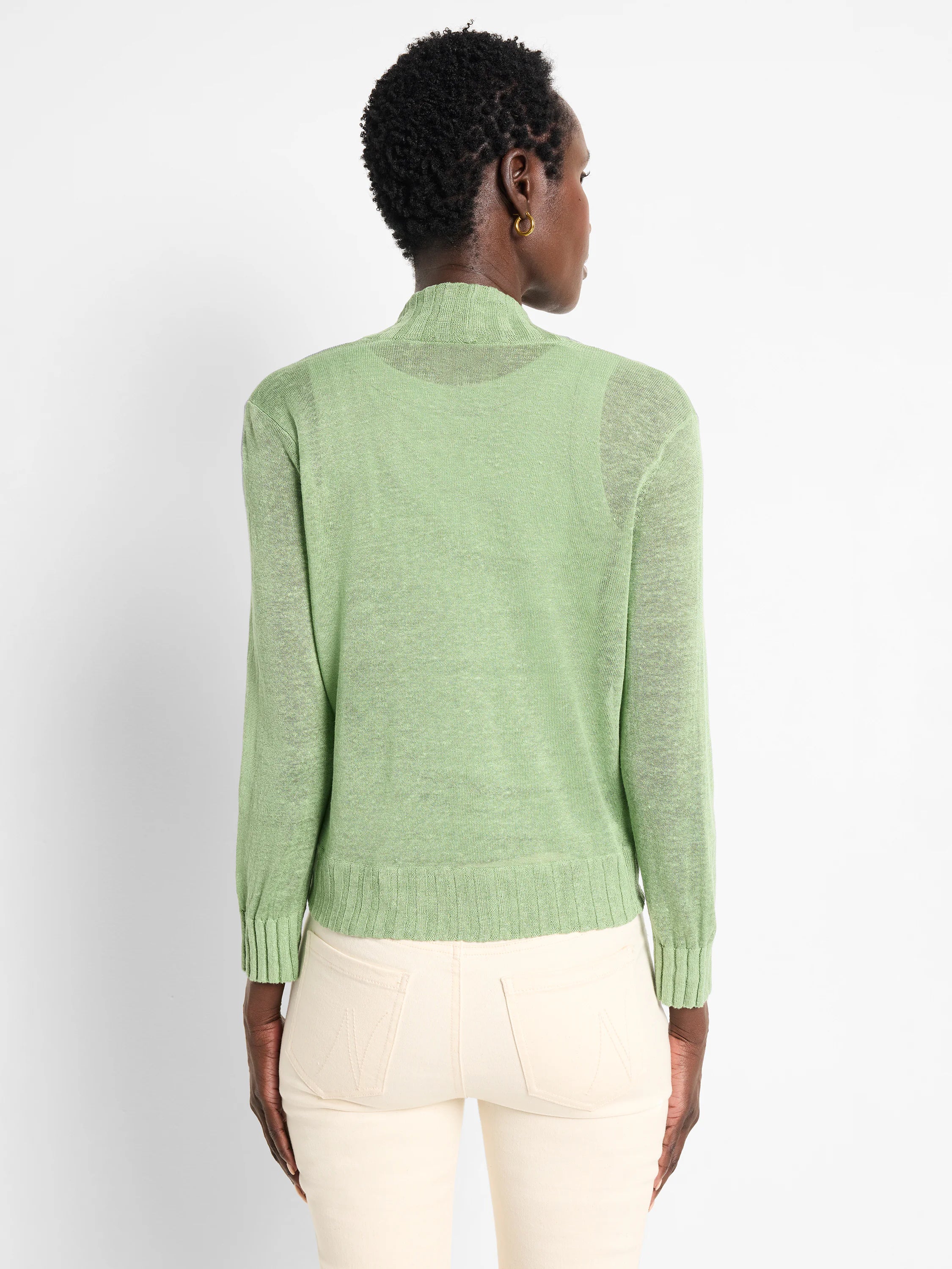 Light green sheer knit bolero cardigan with high neck, long sleeves, and ribbed cuffs & hem.