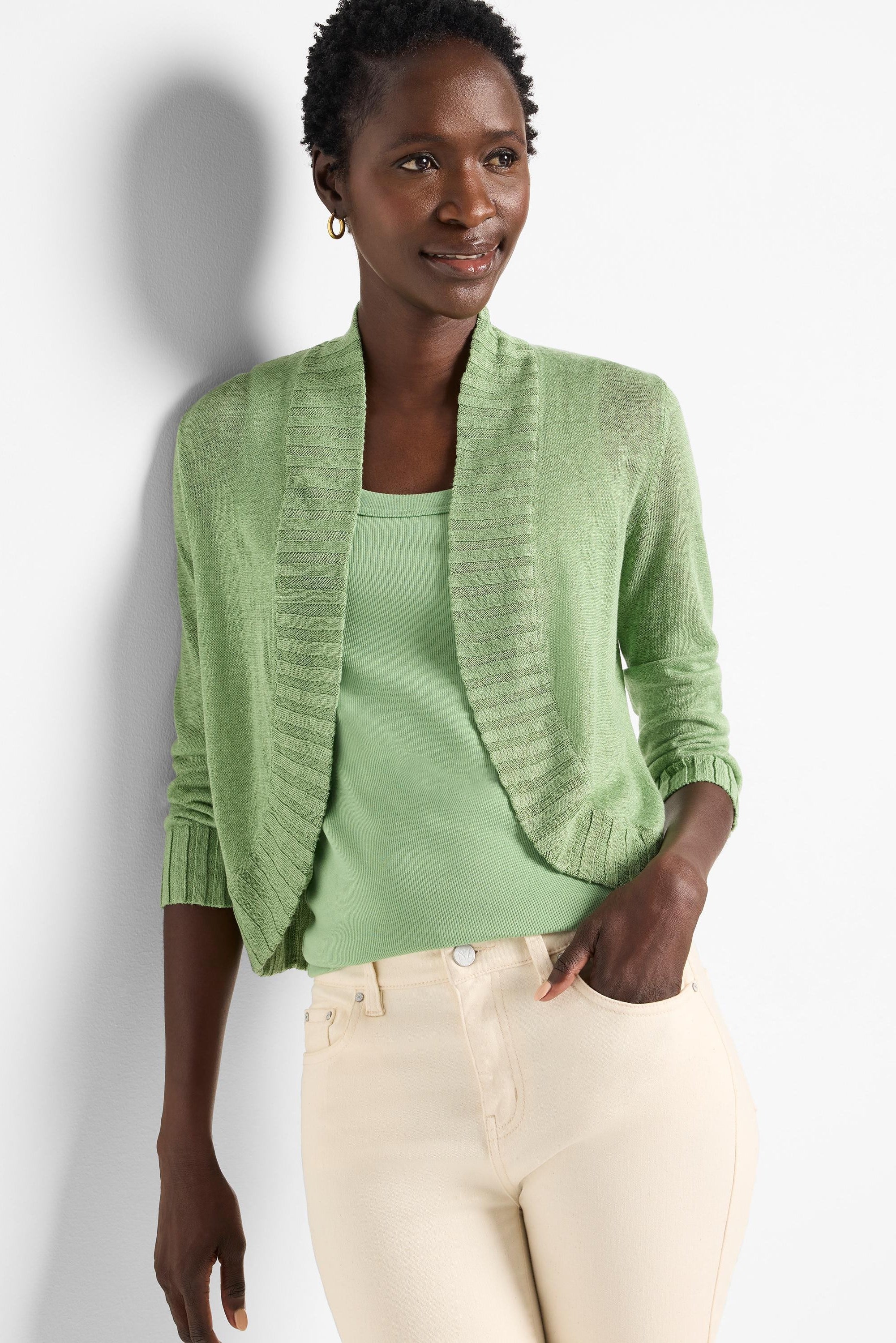 Pale green bolero cardigan with 3/4 sleeves, open front, and ribbed shawl collar & cuffs.