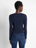 Navy blue ribbed knit cardigan with long sleeves, shown from the back.