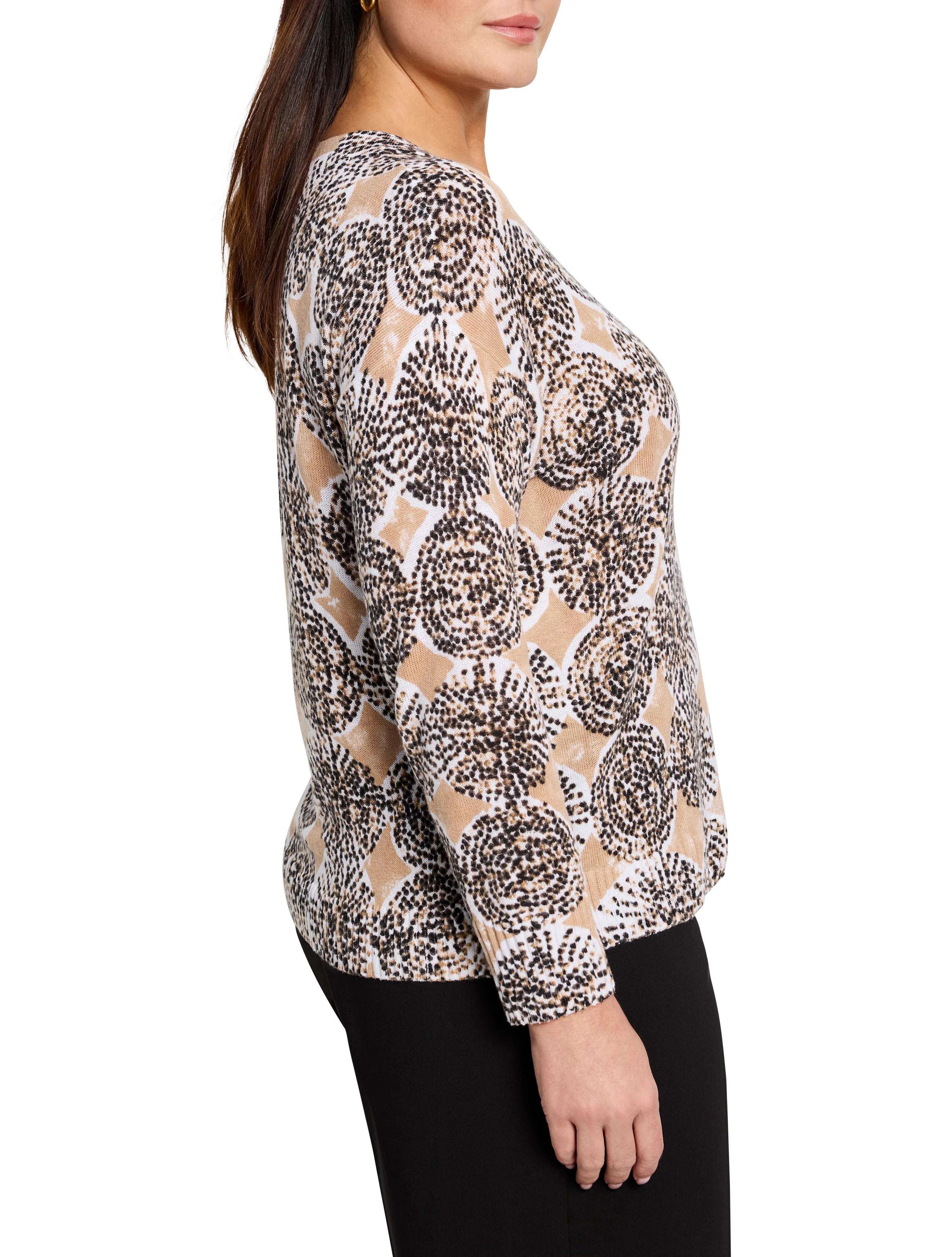 Beige sweater with brown and black circular pattern. Long sleeves.