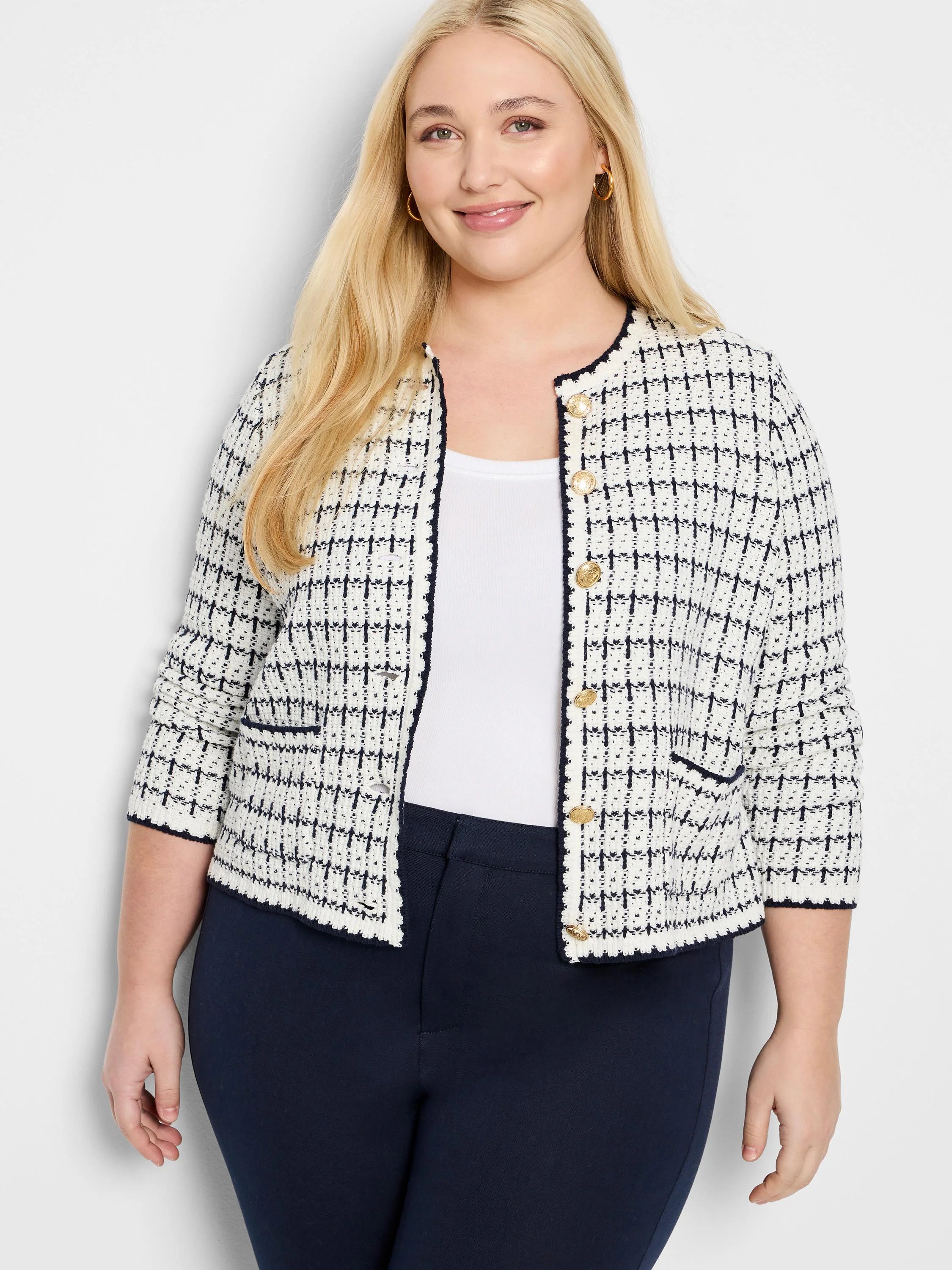 Cream and navy bouclé jacket with a grid pattern, gold buttons, navy scalloped trim, and 3/4 sleeves.