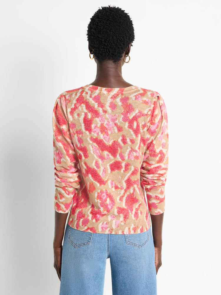 Pink, beige, and white Ikat pattern long-sleeve sweater. Back view.