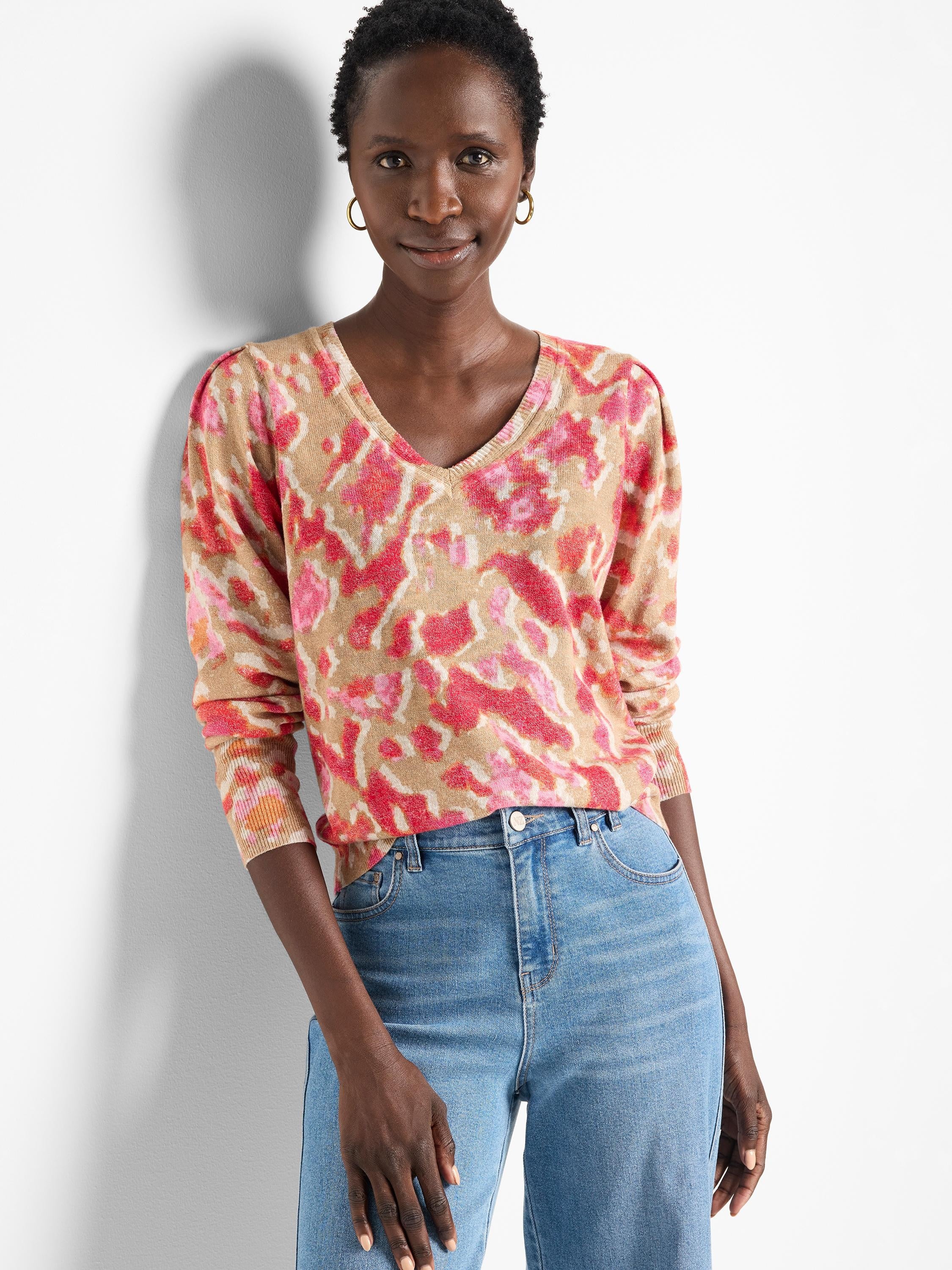 Beige sweater with pink and orange ikat pattern.  V-neck, long sleeves.