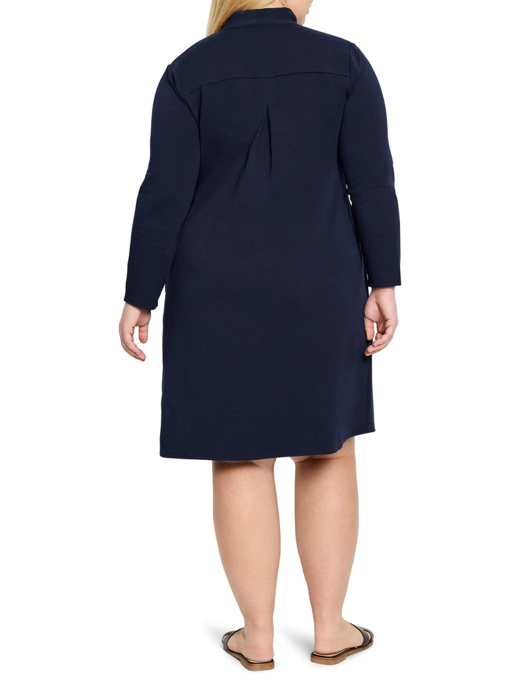 Navy blue, long-sleeved knit dress, A-line silhouette. Back view shows a center pleat detail.