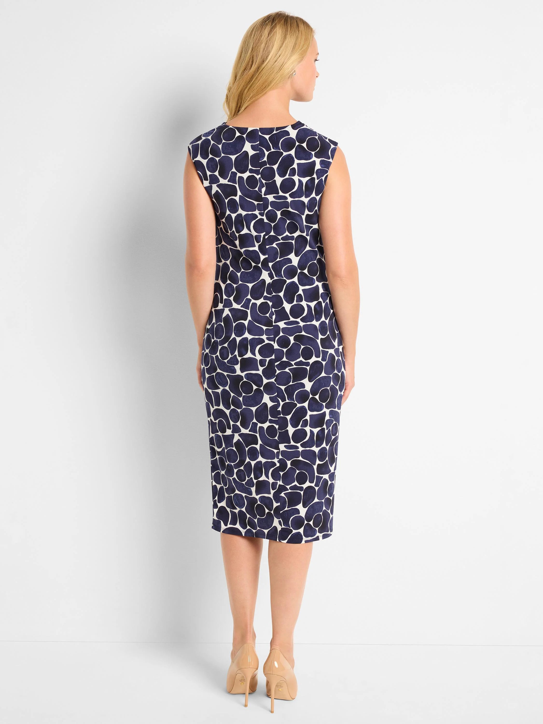 Here's alt text under 125 characters:
"Sleeveless midi dress, navy blue and off-white abstract print. Back view.