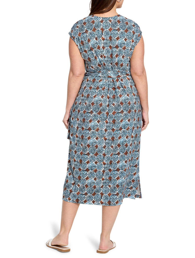 Blue, brown, and white patterned midi dress. Short sleeves, belted waist, side slits. Rear view.