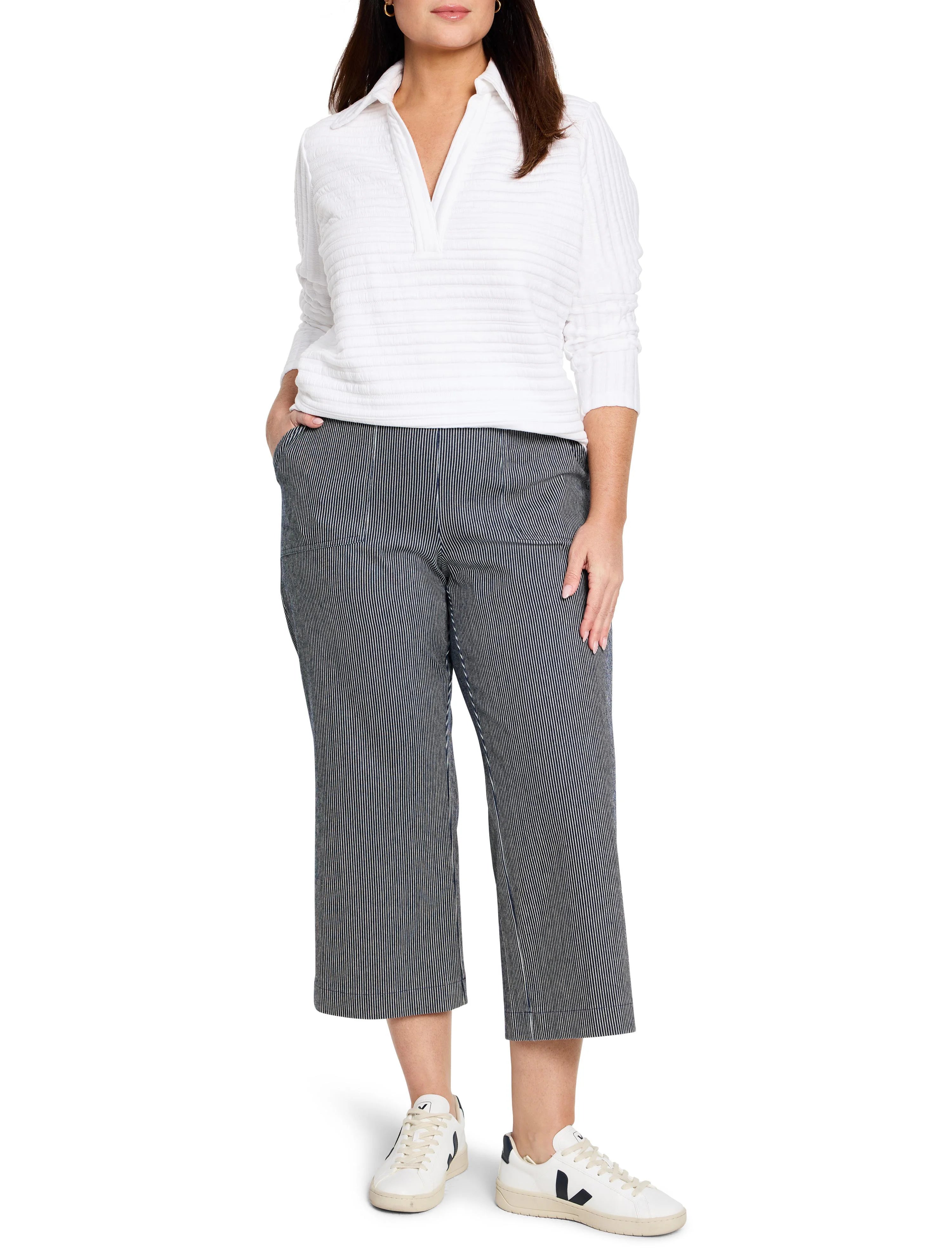 Dark indigo wide-leg jeans with thin white vertical stripes, cropped to ankle-length, shown on a model.