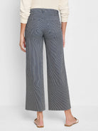 Wide-leg jeans; navy blue and white vertical stripes; raw hem.