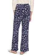 Wide-leg pants; off-white background with navy blue, abstract pebble print.