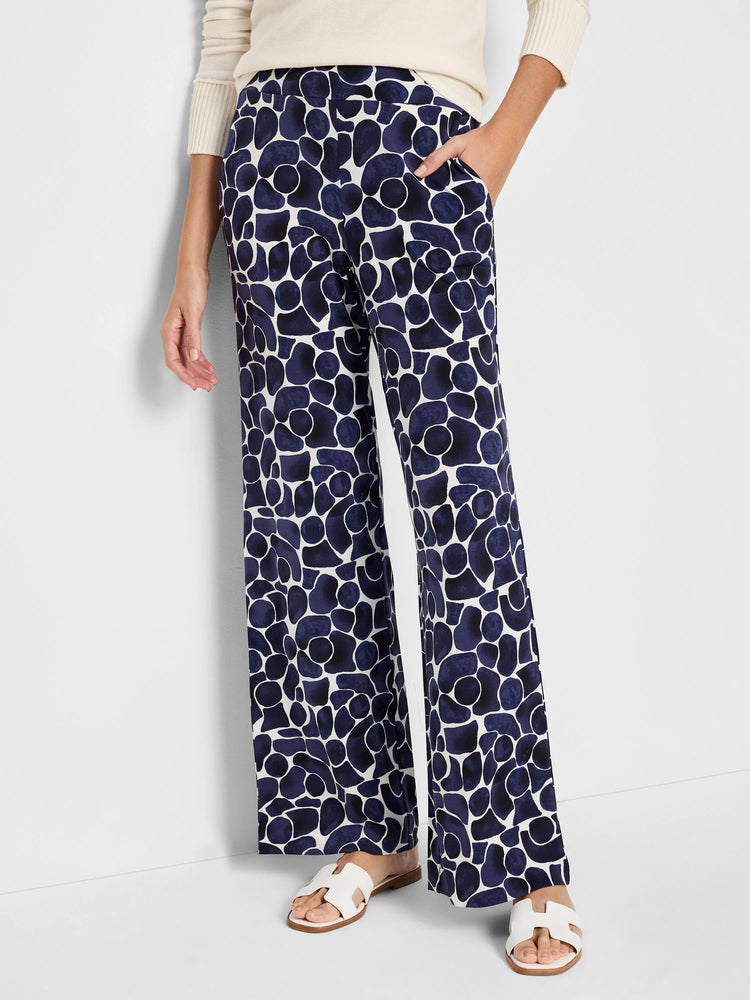 Wide-leg pants; off-white background with navy blue abstract pebble print.