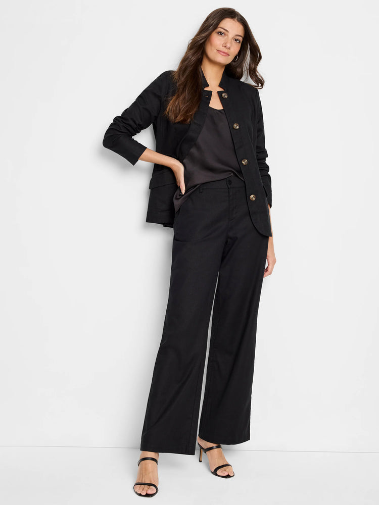 Black linen-cotton blazer with gold buttons, shown on a model. The model also wears black pants and shoes.