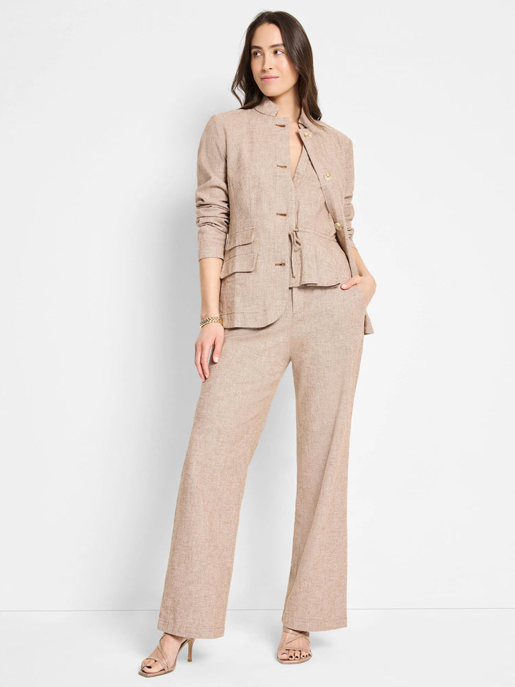 Beige linen-cotton blazer and pants. The blazer has gold buttons and patch pockets. Wide-leg pants.