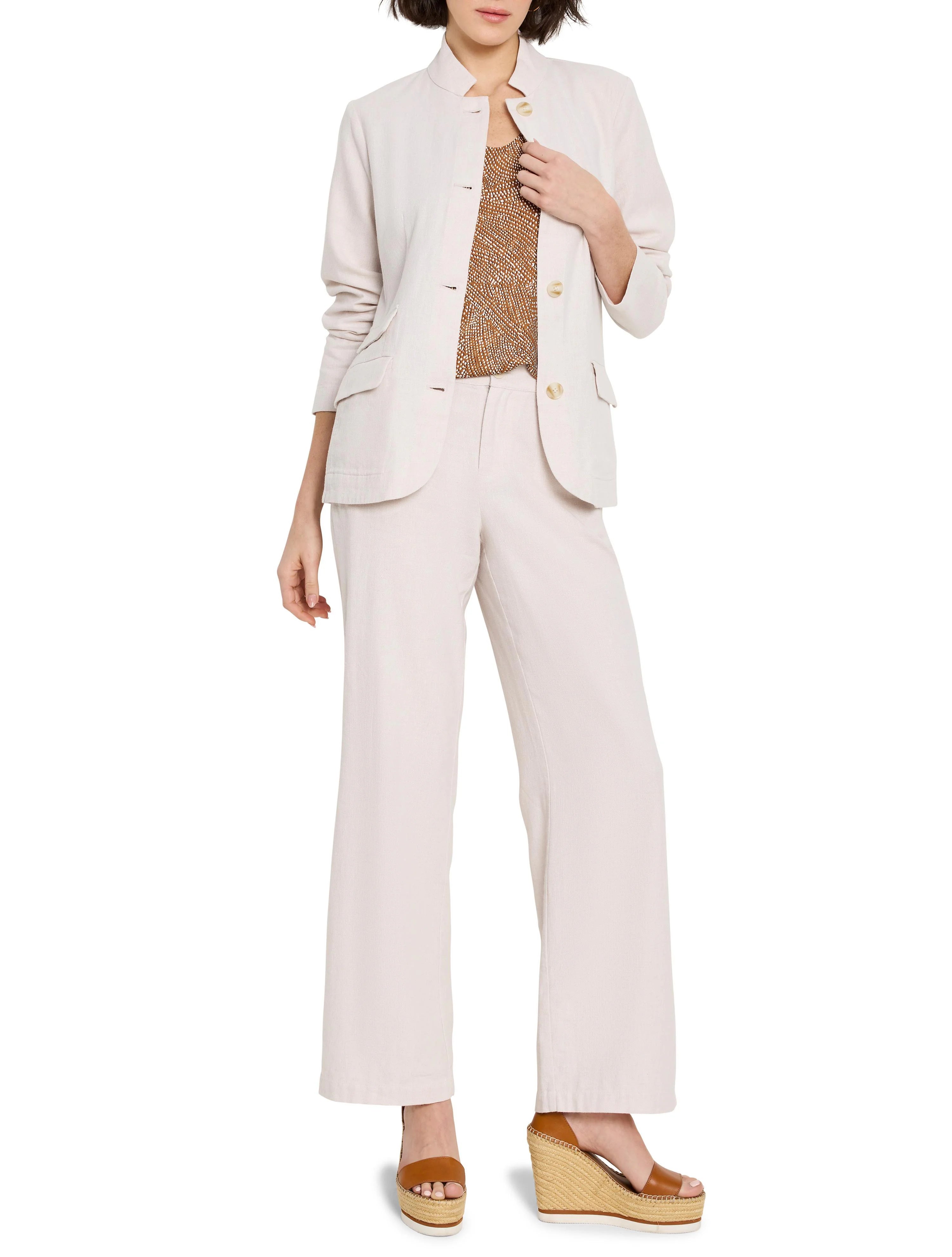 Off-white linen-cotton blazer, button front,  worn with matching pants.  Model also wears a brown top and brown wedges.