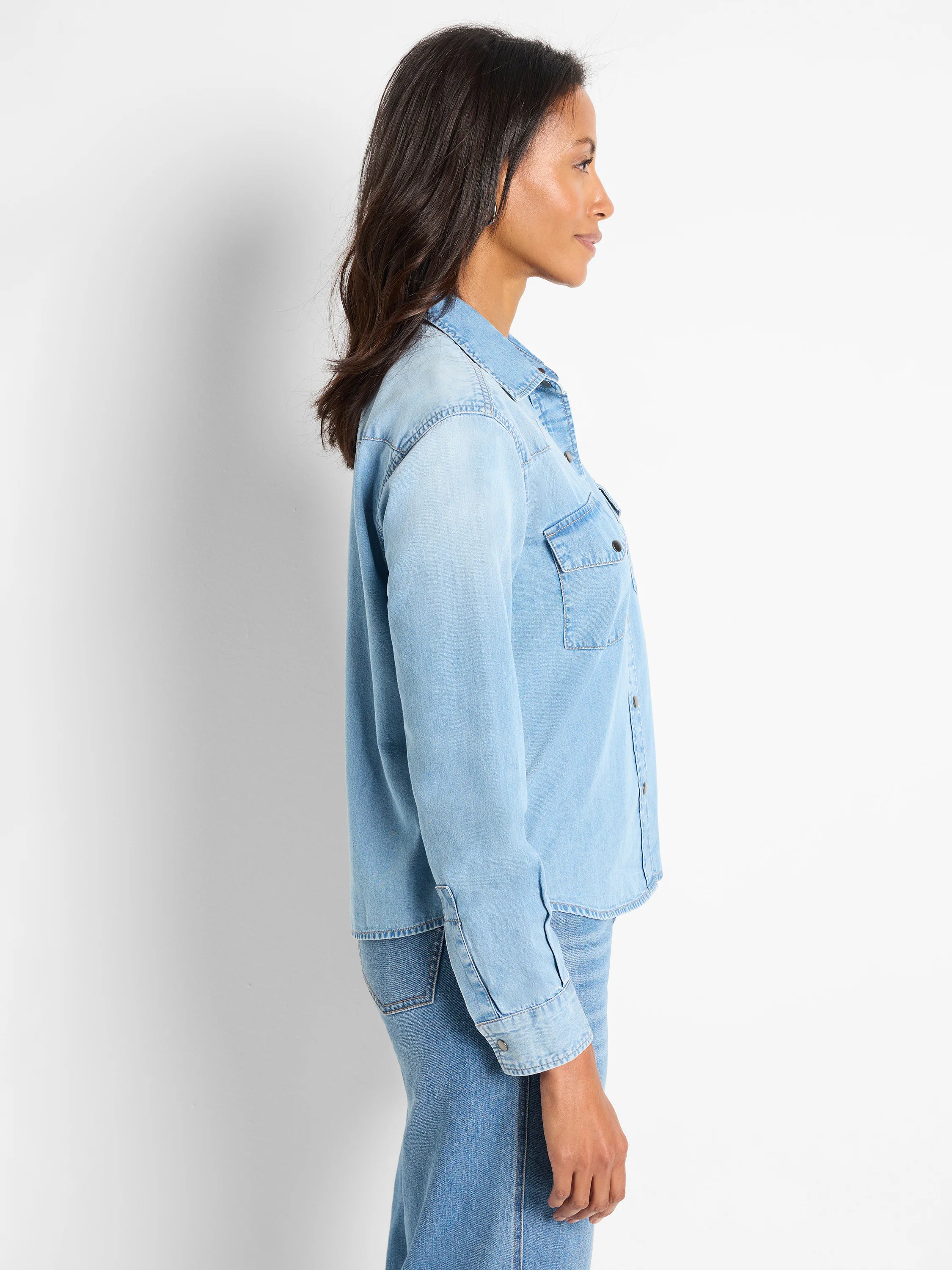 Light blue denim shirt, long sleeves, button front, chest pockets.