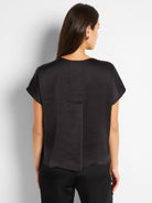 Black woven top, short sleeves, boxy fit, shown from the back.