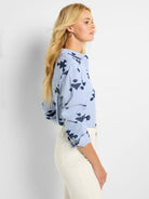 Blue and white striped woven shirt with dark blue stamped pattern.  Long sleeves, button-down collar.