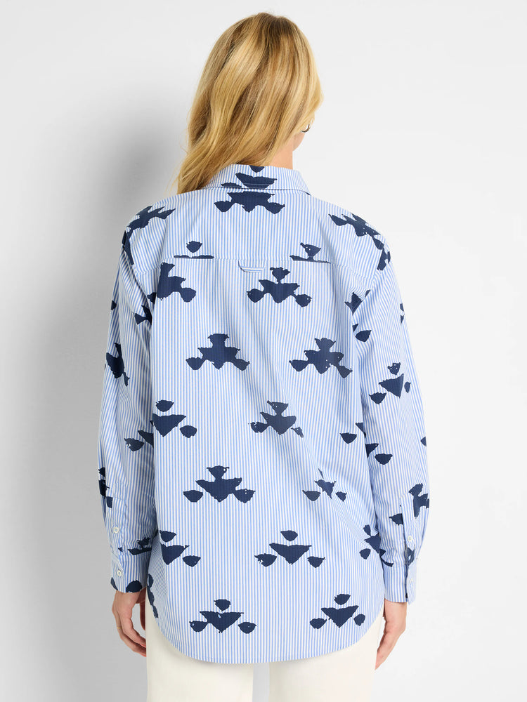 Blue and navy shirt. Light blue stripes with a repeated navy stamped pattern. Long sleeves, collared.