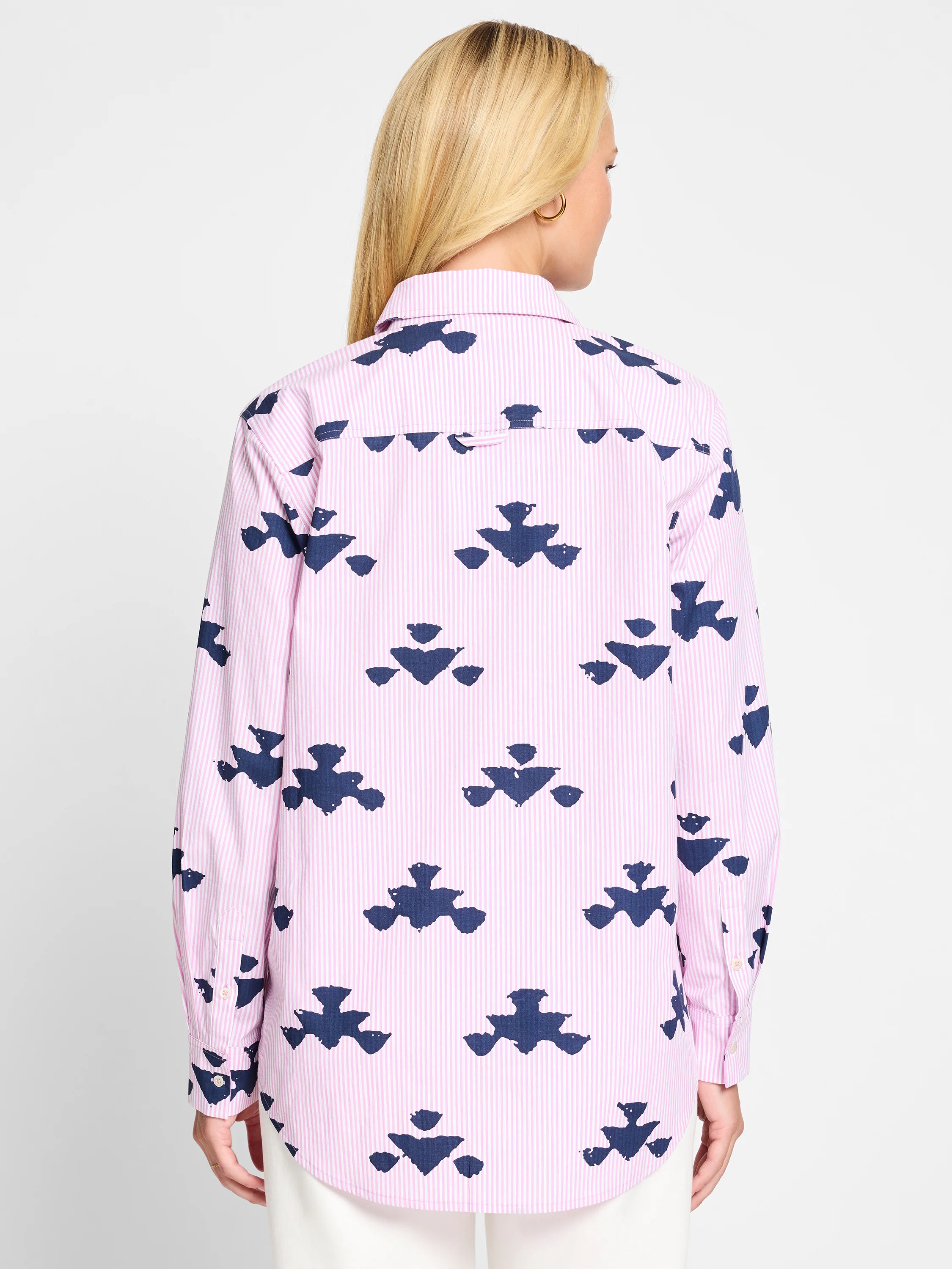 Pink & navy blue striped shirt.  Features a repeating stamped pattern. Long sleeves, button front.