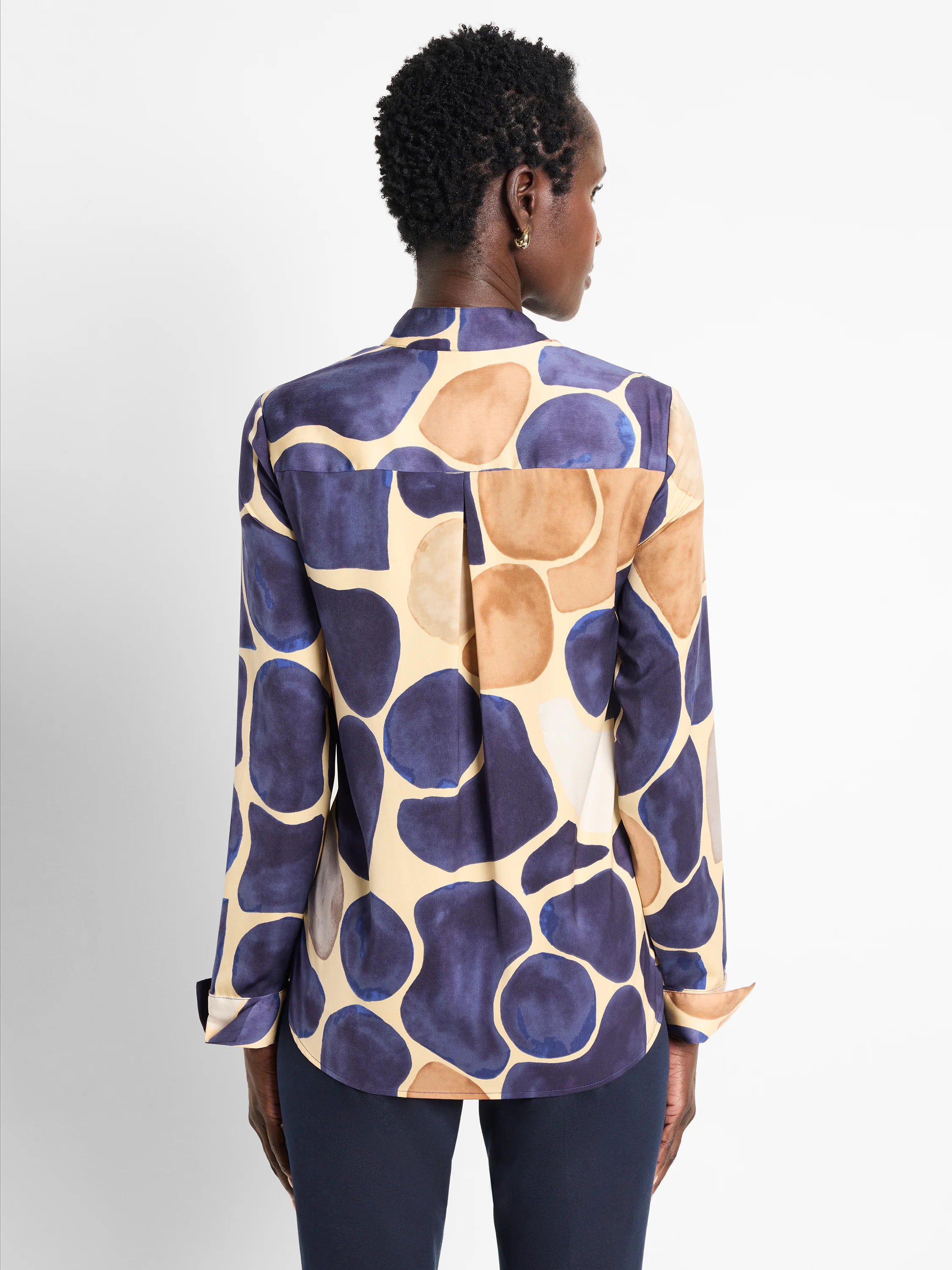 Beige long-sleeve shirt, back view. Features a dark purple and brown abstract pebble pattern.