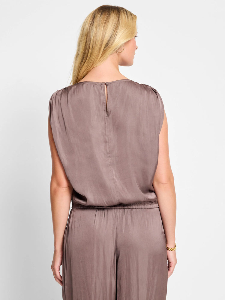 Mauve sleeveless top with ruched shoulders, back view showing center back button closure and elastic waistband.