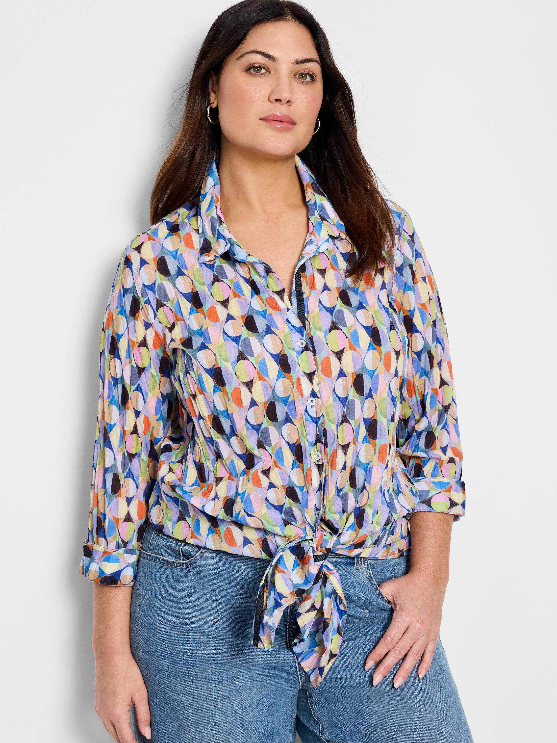 Crinkled shirt with 3/4 sleeves; multicolored abstract print featuring blues, pinks, oranges, & greens; button front;...