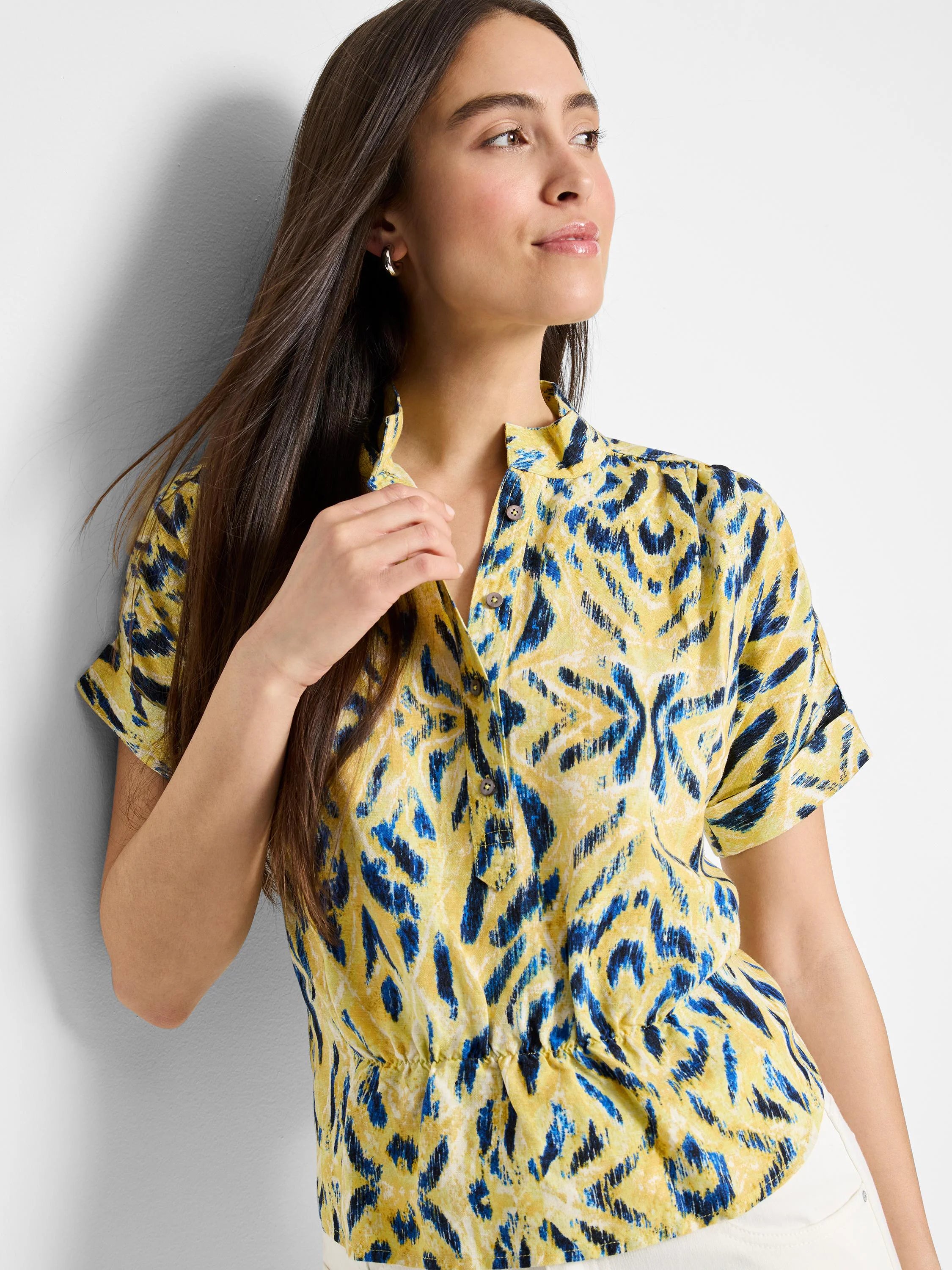 Yellow woven shirt with blue abstract print. Short sleeves, button placket.  Cinched waist.