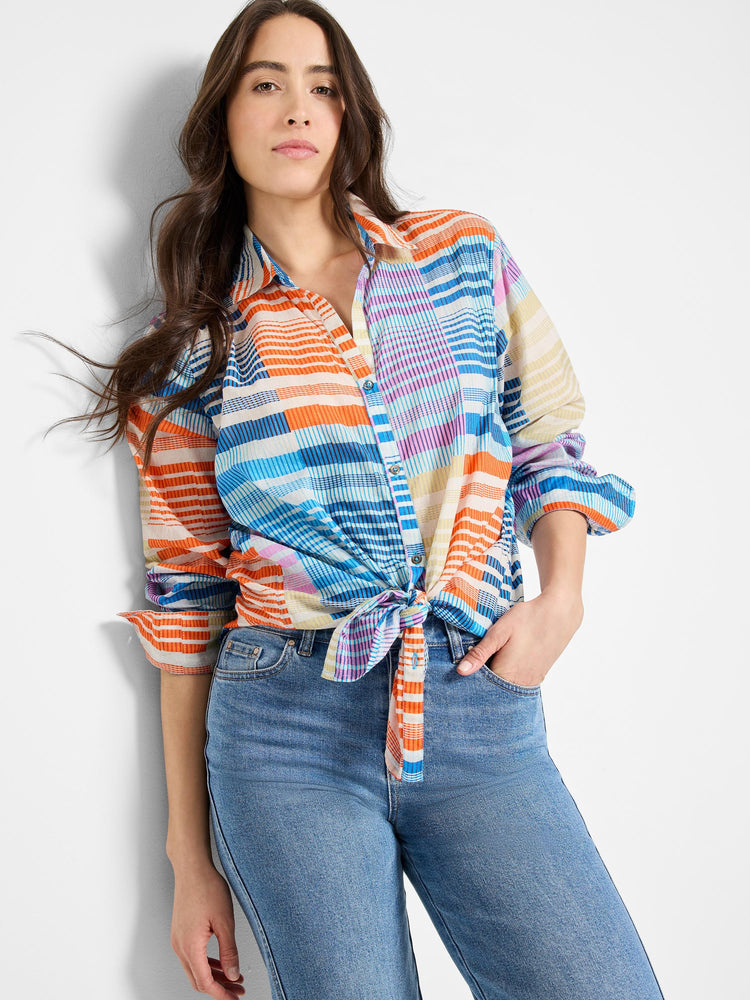 Cotton shirt with orange, blue, purple, and beige stripes in a plaid pattern. Knotted at waist.