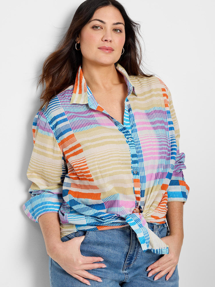 Cotton shirt; multicolored plaid pattern in orange, blue, pink, and beige. Long sleeves, button-front.