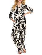 Black and beige abstract print shirt and wide-leg pants.  Three-quarter sleeves, V-neck.