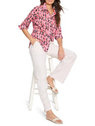 Pink cotton shirt with a dark-pink,  red, and black ikat pattern. Three-quarter sleeves. Collared.