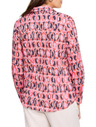 Pink, red, and dark blue ikat ring pattern on long-sleeve collared shirt.  Cotton fabric.